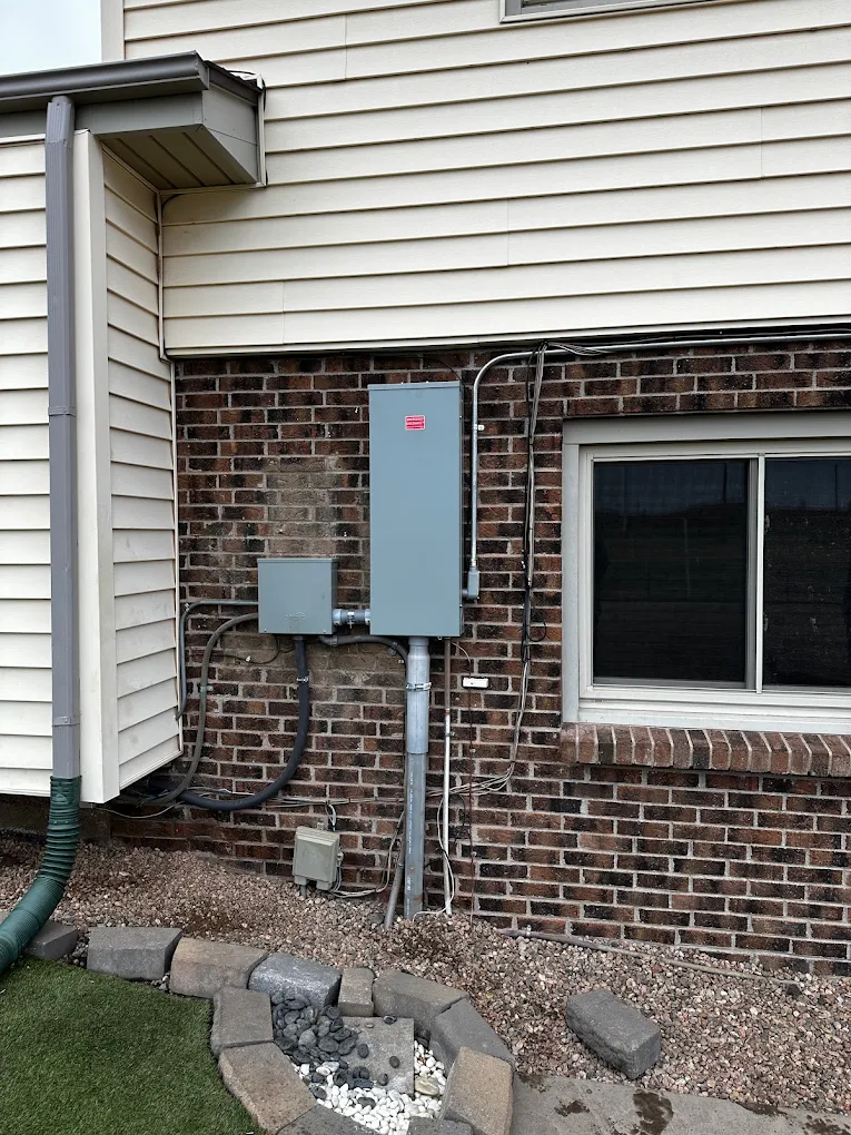 Service upgrade with meter main and junction box on a brick home
