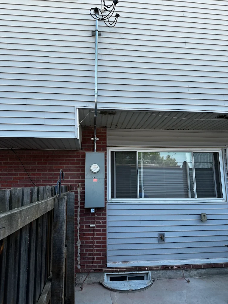 Townhome service upgrade with mast, meter and disconnect