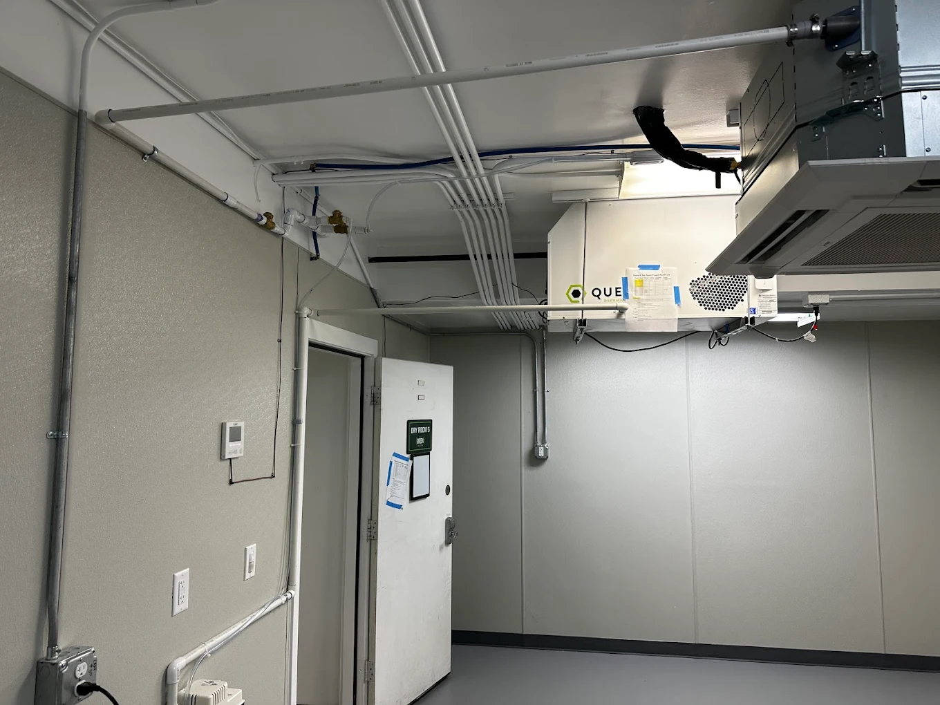 Dry room with conduit runs feeding dehumidification and HVAC equipment
